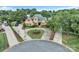 Beautiful brick home with circular driveway and lush landscaping in a well-established neighborhood at 3759 Sand Wedge Dr, Gastonia, NC 28056