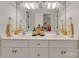 Bathroom featuring a double sink vanity, white cabinets and decorative jars at 3759 Sand Wedge Dr, Gastonia, NC 28056