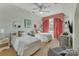 Bedroom with two beds, a window with decorative curtains, and patterned furniture at 3759 Sand Wedge Dr, Gastonia, NC 28056
