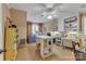 Bright craft room with built-in shelving, desk space, and a ceiling fan at 3759 Sand Wedge Dr, Gastonia, NC 28056