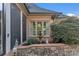 Exterior detail showcasing a charming fountain and lush landscaping at 3759 Sand Wedge Dr, Gastonia, NC 28056