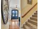 Entryway with double front doors and wood floors, leading to a staircase at 3759 Sand Wedge Dr, Gastonia, NC 28056