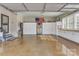 Spacious garage with built-in storage, a refrigerator, and polished concrete floor at 3759 Sand Wedge Dr, Gastonia, NC 28056