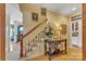 Hallway featuring a staircase, console table, and doorway to another room at 3759 Sand Wedge Dr, Gastonia, NC 28056