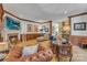 Comfortable living room featuring a fireplace, wood trim, and leather seating at 3759 Sand Wedge Dr, Gastonia, NC 28056