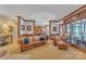 Spacious living room featuring a fireplace, wood trim, and comfortable leather seating at 3759 Sand Wedge Dr, Gastonia, NC 28056