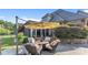 Relaxing outdoor patio with comfortable seating and a large umbrella for shade at 3759 Sand Wedge Dr, Gastonia, NC 28056