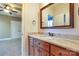 Bathroom features a granite countertop, wooden cabinetry, and a framed mirror at 4124 Sherbrooke Dr, Charlotte, NC 28210