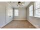 Carpeted bedroom with neutral paint, windows for natural light and closet for storage at 4124 Sherbrooke Dr, Charlotte, NC 28210