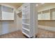 Spacious walk-in closet includes custom shelving and ample storage for clothes and accessories at 4124 Sherbrooke Dr, Charlotte, NC 28210