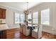 Cozy dining room with plantation shutters and a modern chandelier at 4124 Sherbrooke Dr, Charlotte, NC 28210