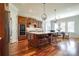 Kitchen area featuring a large island, pendant lights, and a stainless steel double oven at 4124 Sherbrooke Dr, Charlotte, NC 28210