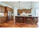 Modern kitchen with large island, stainless steel refrigerator, and custom wood cabinetry at 4124 Sherbrooke Dr, Charlotte, NC 28210