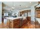 Gourmet kitchen features a large island, farmhouse sink, custom cabinets, and stainless appliances at 4124 Sherbrooke Dr, Charlotte, NC 28210