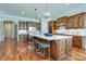 Bright kitchen with a spacious island, pendant lights, and stainless steel appliances at 4124 Sherbrooke Dr, Charlotte, NC 28210