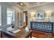 Bright office space featuring hardwood floors, an antique desk, and abundant natural light at 4124 Sherbrooke Dr, Charlotte, NC 28210