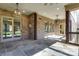 Outdoor patio features a stone fireplace, tile flooring, and comfortable seating area at 4124 Sherbrooke Dr, Charlotte, NC 28210