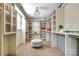 Large walk-in closet with bright lighting and custom shelving offering ample storage space at 4124 Sherbrooke Dr, Charlotte, NC 28210