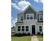 A stunning two-story townhome showcasing classic architecture and landscaping at 4714 Lakeview Rd # 11, Charlotte, NC 28216