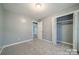 Bedroom with soft gray walls, plush carpet, and ample closet space at 6126 Eagle Peak Dr, Charlotte, NC 28214