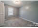 Cozy bedroom features neutral walls, carpet flooring, and a closet at 6126 Eagle Peak Dr, Charlotte, NC 28214