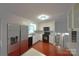 Bright kitchen features white cabinets, stainless steel refrigerator and black appliances at 6126 Eagle Peak Dr, Charlotte, NC 28214