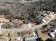 Aerial view of home in a wooded neighborhood with a private driveway at 619 Berkshire Dr, Statesville, NC 28677