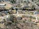 An aerial view shows a residential area with mature trees and single-Gathering homes in a quiet neighborhood at 619 Berkshire Dr, Statesville, NC 28677