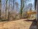 Spacious backyard with a wooden deck and mature trees at 619 Berkshire Dr, Statesville, NC 28677