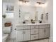 Bathroom featuring double vanity with gray cabinets and black fixtures at 619 Berkshire Dr, Statesville, NC 28677