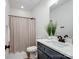 Bathroom featuring a blue vanity, white countertop, and a shower with a curtain at 619 Berkshire Dr, Statesville, NC 28677