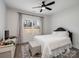 Bright bedroom with a neutral color scheme, large window, and a ceiling fan at 619 Berkshire Dr, Statesville, NC 28677