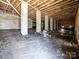 A crawl space with concrete pillars and insulation at 619 Berkshire Dr, Statesville, NC 28677