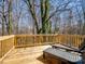Wooden deck with outdoor seating overlooking the wooded backyard at 619 Berkshire Dr, Statesville, NC 28677