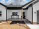 Inviting front porch with two rocking chairs perfect for enjoying the outdoors at 619 Berkshire Dr, Statesville, NC 28677
