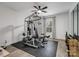 Well-lit home gym with a weight machine and hardwood flooring at 619 Berkshire Dr, Statesville, NC 28677