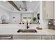 Open kitchen showcasing white countertops, stainless steel appliances, and an open floor plan at 619 Berkshire Dr, Statesville, NC 28677