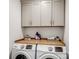 Laundry room with a butcher block countertop, washer and dryer hookups, and gray cabinets at 619 Berkshire Dr, Statesville, NC 28677