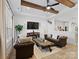 Comfortable living room with plush seating, ceiling fan, and a decorative fireplace at 619 Berkshire Dr, Statesville, NC 28677