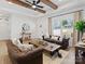 Cozy living room area with stylish furniture, an area rug and natural light at 619 Berkshire Dr, Statesville, NC 28677