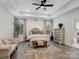 Spacious main bedroom features neutral tones, plush seating, and ample natural light at 619 Berkshire Dr, Statesville, NC 28677