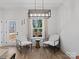 Sitting area with cozy chairs, natural light and access to the deck at 619 Berkshire Dr, Statesville, NC 28677