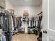 Walk-in closet with ample storage and wooden shelves at 619 Berkshire Dr, Statesville, NC 28677