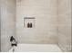 Modern bathroom with beige tile and black fixtures at 6813 Elm Forest Dr, Charlotte, NC 28212