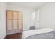 Bedroom with hardwood floors and a light colored armoire at 6813 Elm Forest Dr, Charlotte, NC 28212