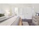Bright bedroom with dark wood floors, white walls, and ensuite bathroom at 6813 Elm Forest Dr, Charlotte, NC 28212