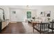 Bright living room featuring modern décor, hardwood flooring, and a view of the front yard through a window at 6813 Elm Forest Dr, Charlotte, NC 28212