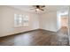 Bright bedroom with hardwood floors, a ceiling fan, and natural light from a large window at 735 Green St, Rock Hill, SC 29730