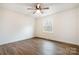 Bright bedroom with hardwood floors, a ceiling fan, and a sun-drenched window at 735 Green St, Rock Hill, SC 29730