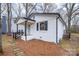 Side view of painted brick house, black trim, covered porch, and stone pathway to the front door at 735 Green St, Rock Hill, SC 29730